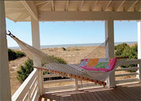 Bald Head Island porch with a comfy-looking hammock. Crawl in, relax and enjoy the ocean breezes.
