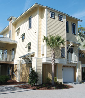 A picture of a yellow condo at the Preserve at the Clam Farm.