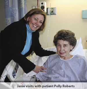 Janie Sinacore-Jaberg visits with Polly Roberts, a patient at the hospital.